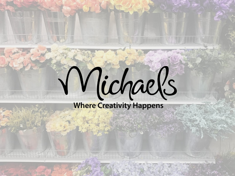 Michaels logo for Palouse Place overlaid on shelves of flowers in pots